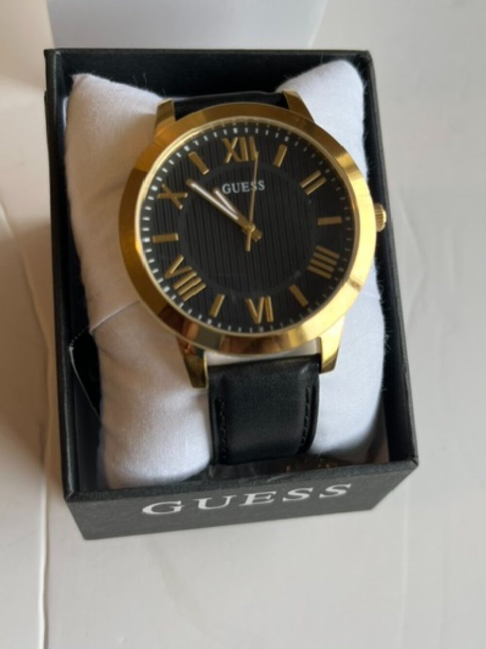 Guess men’s analog watch.